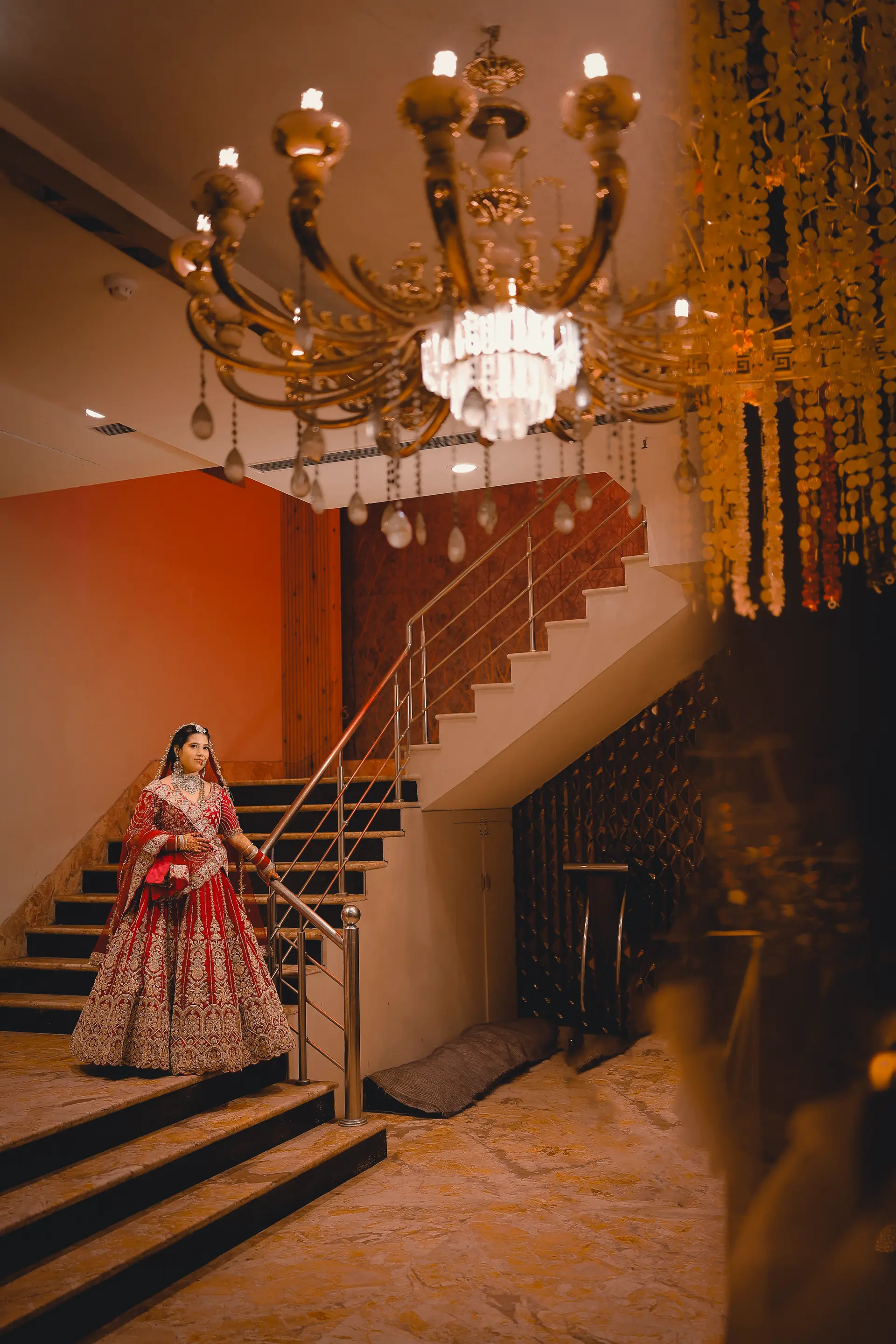 Shubham & Pooja bridal portrait on a staircase by The Wedding Galaxy